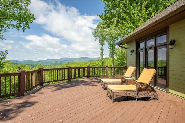 wooden terrace featuring a mountain view