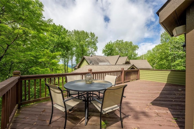 deck featuring outdoor dining area
