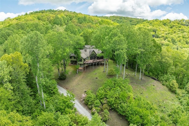 view from above of property with a forest