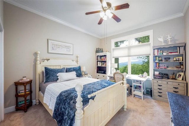 bedroom featuring light colored carpet, ornamental molding, a ceiling fan, and baseboards