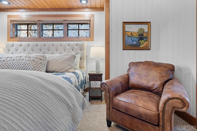 carpeted bedroom with wooden ceiling