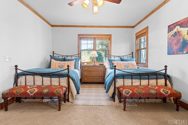 carpeted bedroom with multiple windows, ornamental molding, and ceiling fan