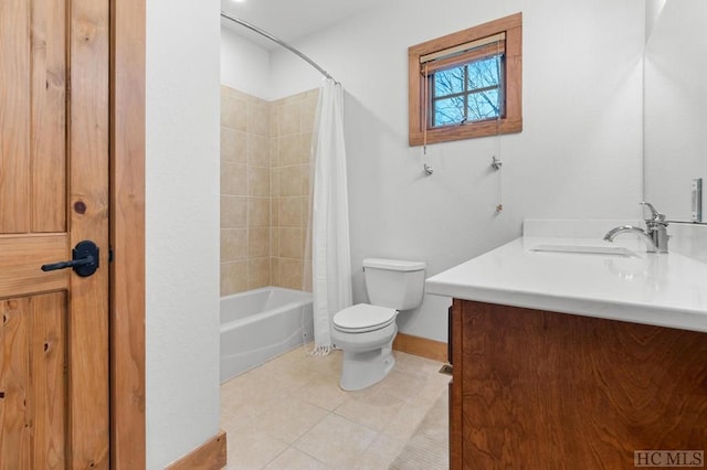 full bathroom with tile patterned floors, toilet, vanity, and shower / bath combo with shower curtain