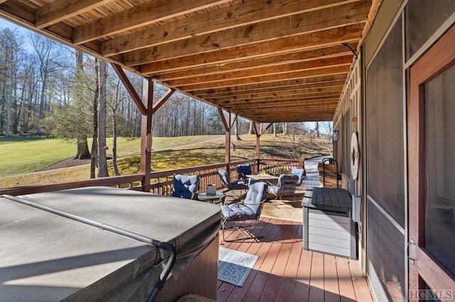 wooden deck featuring outdoor lounge area and a hot tub