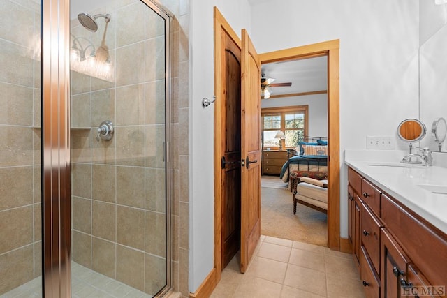 bathroom with tile patterned floors, an enclosed shower, and vanity