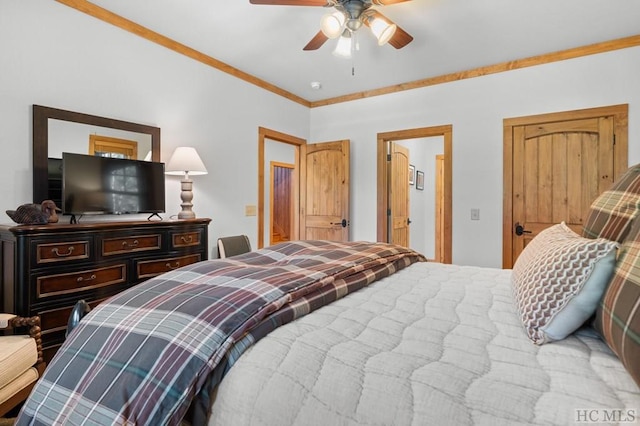 bedroom with ceiling fan and ornamental molding