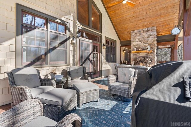 view of patio / terrace with an outdoor stone fireplace