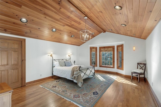 bedroom featuring lofted ceiling, wood ceiling, and light wood-type flooring