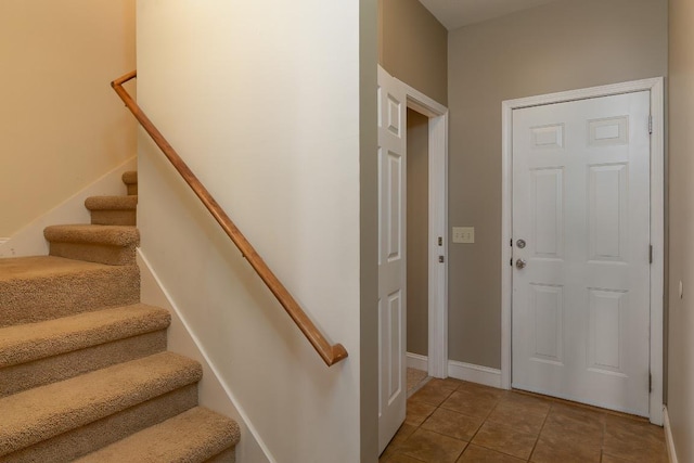 129 Skyline Park Dr, Franklin, NC 28734 - entryway featuring tile patterned flooring, stairway, and baseboards