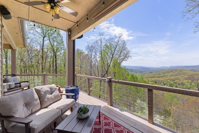129 Skyline Park Dr, Franklin, NC 28734 - wooden deck with ceiling fan, outdoor lounge area, a view of trees, and a mountain view