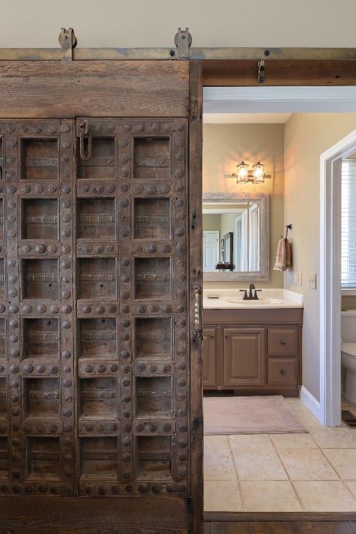 129 Skyline Park Dr, Franklin, NC 28734 - bathroom featuring toilet, vanity, and baseboards