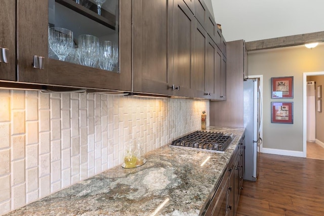 129 Skyline Park Dr, Franklin, NC 28734 - kitchen with stainless steel appliances, decorative backsplash, dark wood-type flooring, light stone countertops, and baseboards