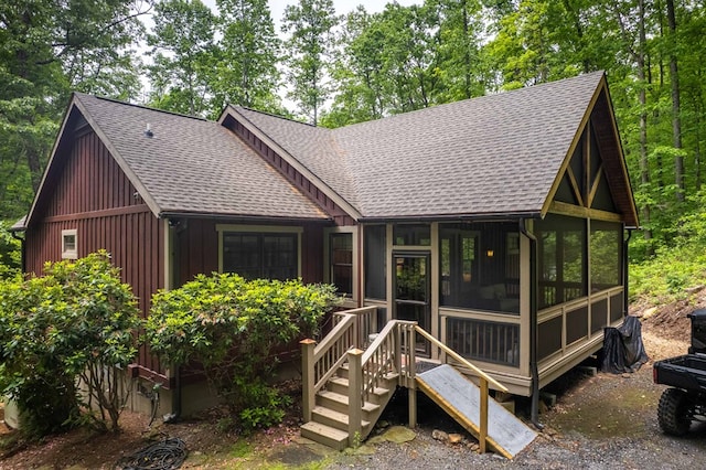45 Boulder Creek Ln, Tuckasegee, NC 28783 - rear view of property with a shingled roof and a sunroom