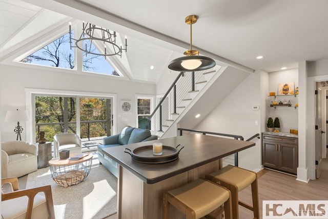 dining room featuring stairs, light wood-style floors, and recessed lighting