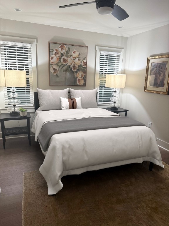 bedroom with a ceiling fan, crown molding, and baseboards