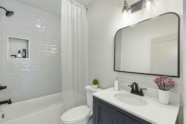 full bath with toilet, shower / bath combo, and vanity