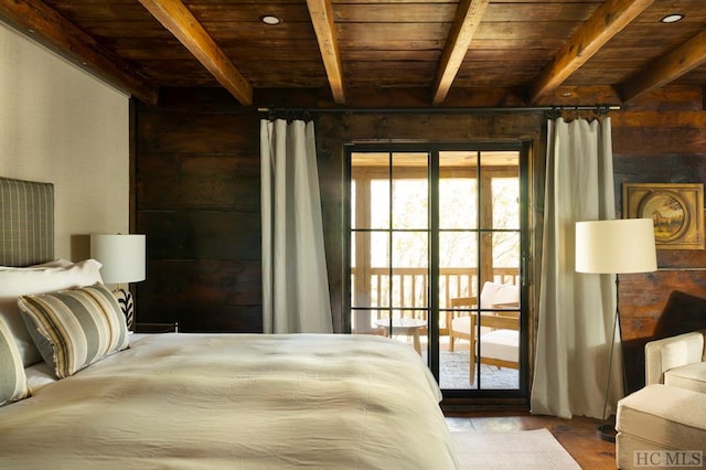 bedroom featuring beam ceiling, access to exterior, and wood ceiling