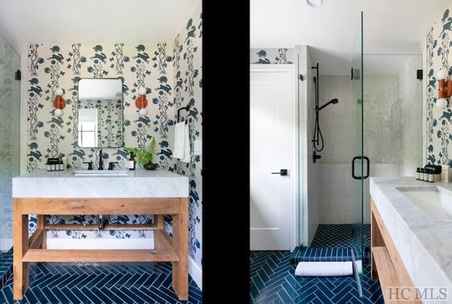 bathroom with tile patterned flooring, an enclosed shower, and vanity