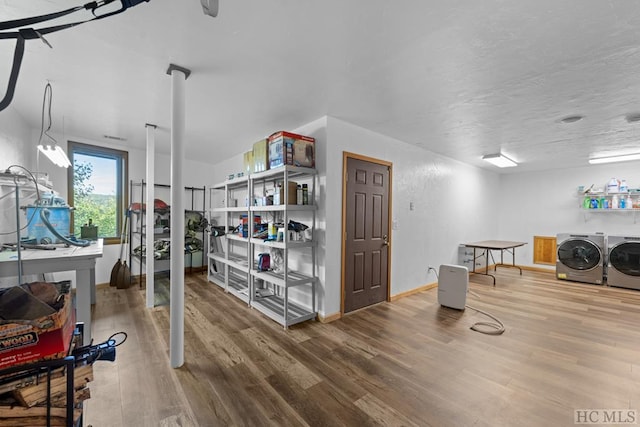 interior space featuring hardwood / wood-style flooring and washer and dryer