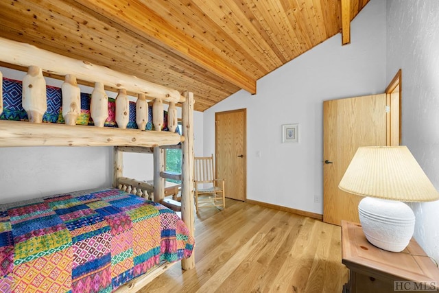 bedroom with wood ceiling, light hardwood / wood-style flooring, and lofted ceiling with beams