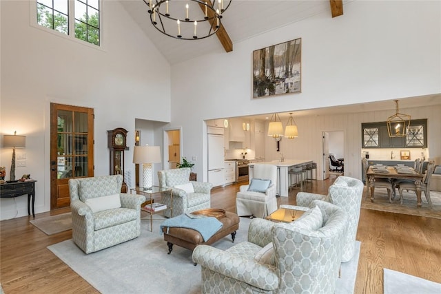 510 Boiling Springs Rd, Sapphire, NC 28774 - living room with high vaulted ceiling, a chandelier, and light wood-style flooring