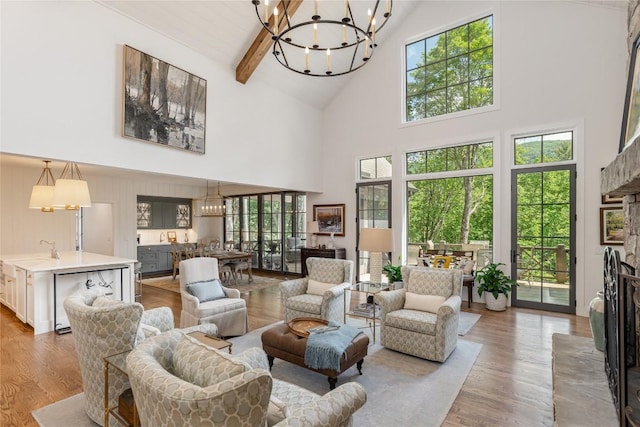 510 Boiling Springs Rd, Sapphire, NC 28774 - living area with a chandelier, high vaulted ceiling, wood finished floors, healthy amount of natural light, and beamed ceiling