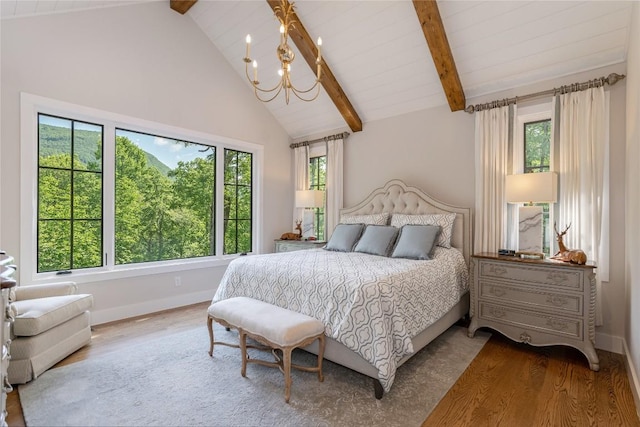 510 Boiling Springs Rd, Sapphire, NC 28774 - bedroom featuring a chandelier, wood finished floors, beamed ceiling, and high vaulted ceiling