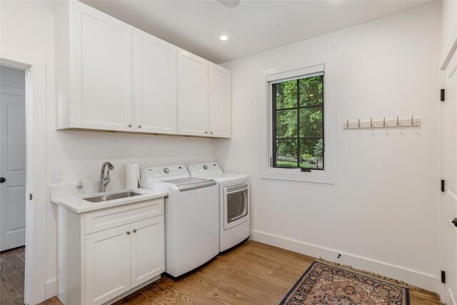 510 Boiling Springs Rd, Sapphire, NC 28774 - laundry room with washing machine and dryer, cabinet space, light wood-style flooring, and recessed lighting