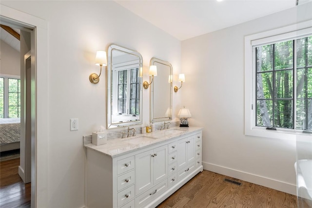 510 Boiling Springs Rd, Sapphire, NC 28774 - ensuite bathroom featuring wood finished floors and double vanity