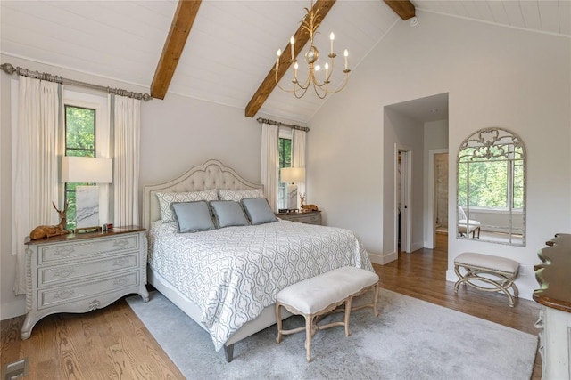 510 Boiling Springs Rd, Sapphire, NC 28774 - bedroom featuring wood finished floors, beam ceiling, a chandelier, multiple windows, and high vaulted ceiling