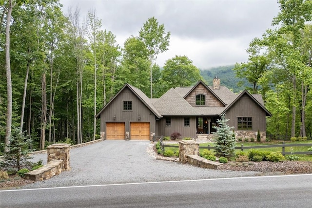 510 Boiling Springs Rd, Sapphire, NC 28774 - view of front facade with a chimney, gravel driveway, a shingled roof, and stone siding