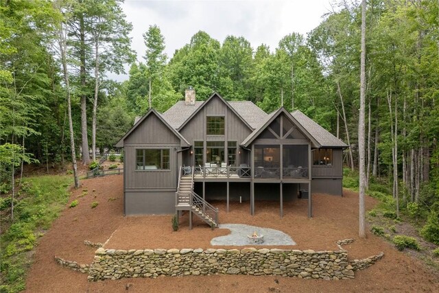 510 Boiling Springs Rd, Sapphire, NC 28774 - rear view of house with a chimney, stairs, a sunroom, a wooden deck, and a wooded view
