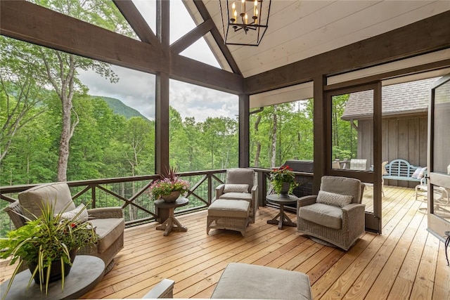 510 Boiling Springs Rd, Sapphire, NC 28774 - sunroom with a chandelier, a forest view, lofted ceiling, and healthy amount of natural light