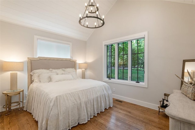 510 Boiling Springs Rd, Sapphire, NC 28774 - bedroom with a chandelier, high vaulted ceiling, and wood finished floors