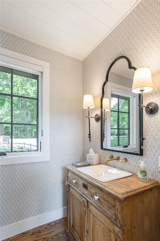 510 Boiling Springs Rd, Sapphire, NC 28774 - bathroom featuring plenty of natural light, wood finished floors, vanity, and wallpapered walls