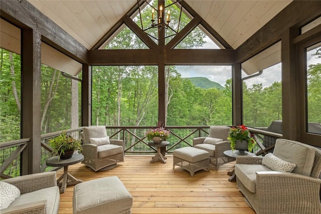 510 Boiling Springs Rd, Sapphire, NC 28774 - sunroom with lofted ceiling, a forest view, a chandelier, and outdoor lounge area