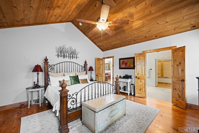 bedroom featuring light wood-type flooring, vaulted ceiling, ceiling fan, and wood ceiling