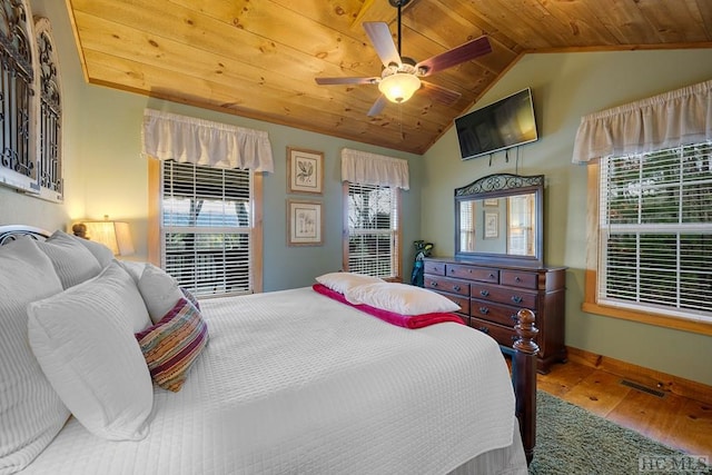 bedroom featuring hardwood / wood-style flooring, ceiling fan, vaulted ceiling, and wood ceiling