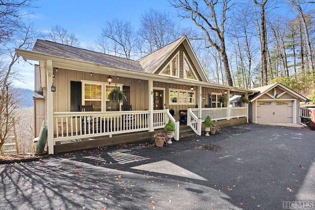 single story home with covered porch and a garage