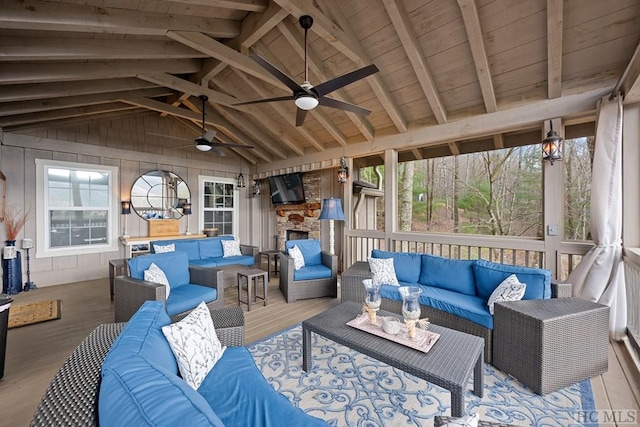 exterior space with vaulted ceiling with beams, ceiling fan, and wood ceiling