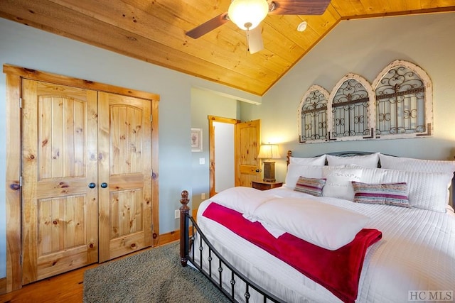 bedroom featuring ceiling fan, lofted ceiling, wood-type flooring, and wooden ceiling