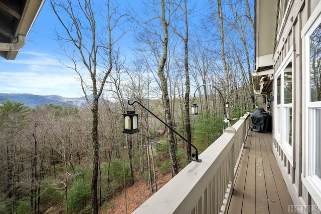 balcony featuring a mountain view and area for grilling