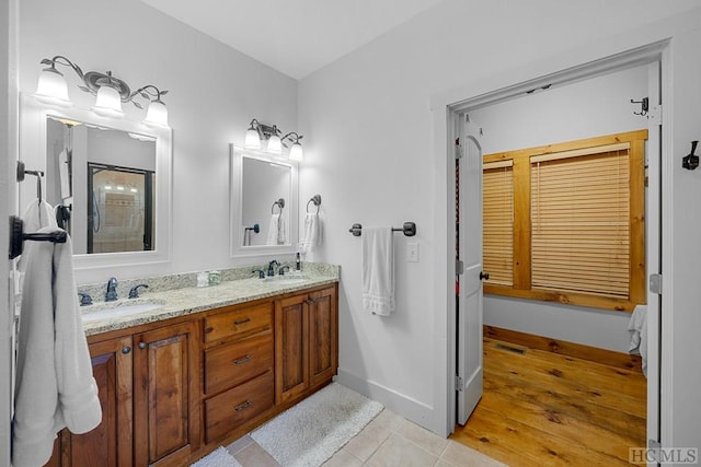 bathroom with vanity and tile patterned floors