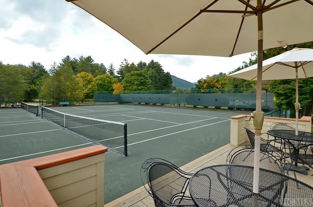 view of sport court with a mountain view