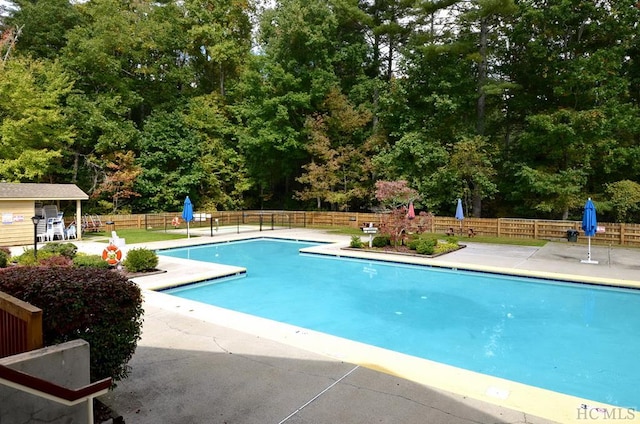 view of swimming pool featuring a patio