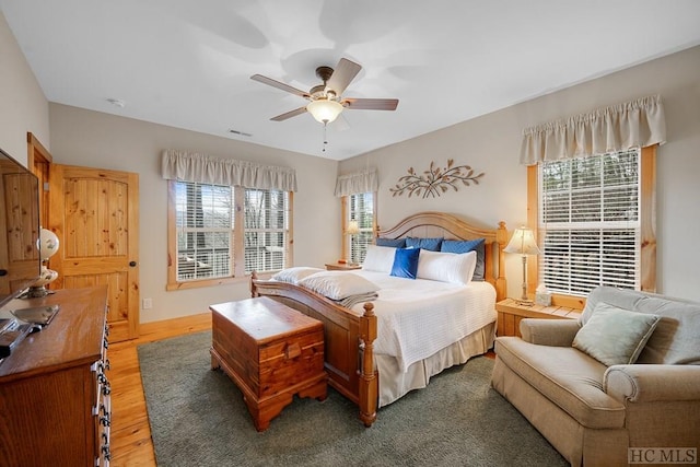 bedroom with hardwood / wood-style flooring and ceiling fan