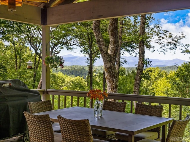 deck featuring area for grilling and a mountain view