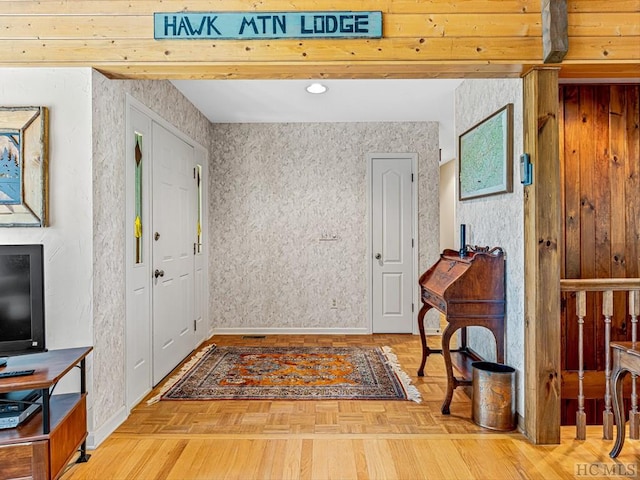 foyer featuring parquet floors