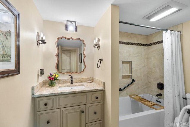 bathroom with vanity and shower / bath combo