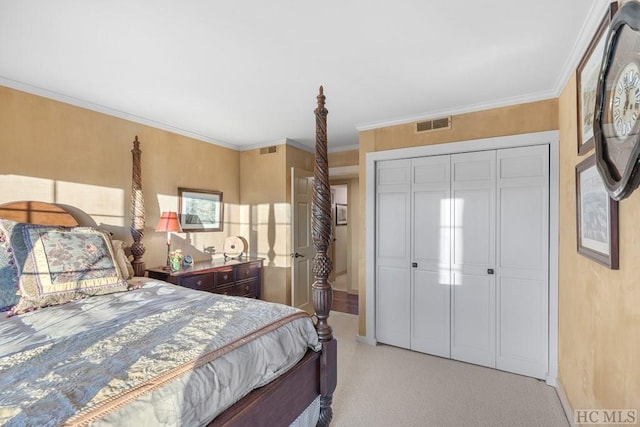 carpeted bedroom featuring crown molding and a closet